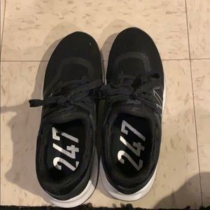 Black/white New Balance shoes.